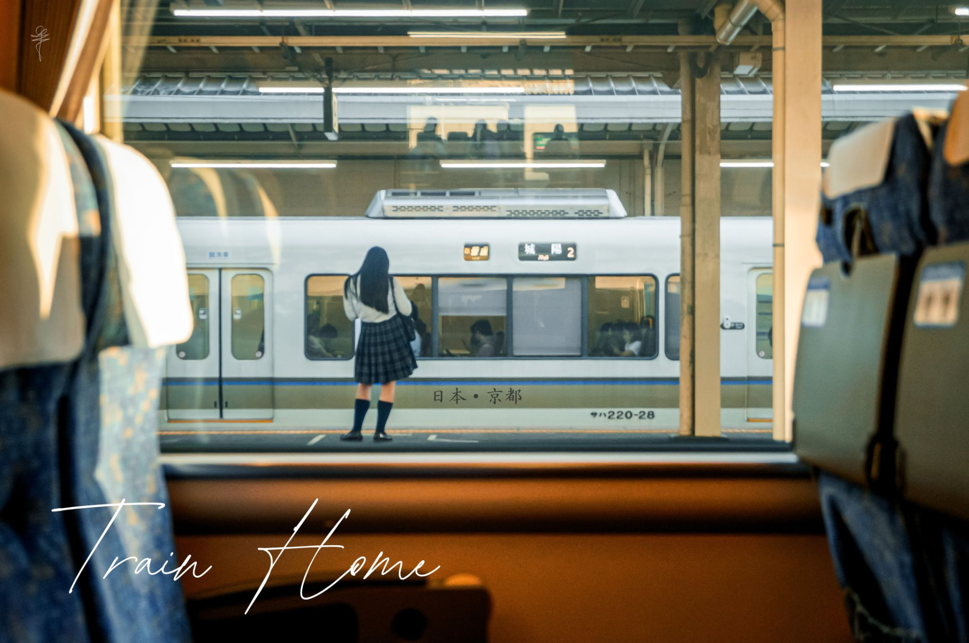 School student waiting on a Kyoto train platform